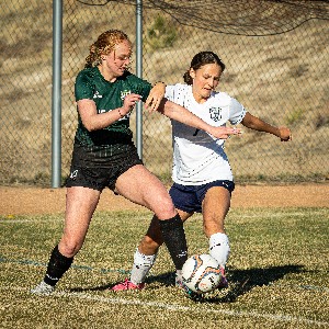 JV Girls Soccer player defends the ball